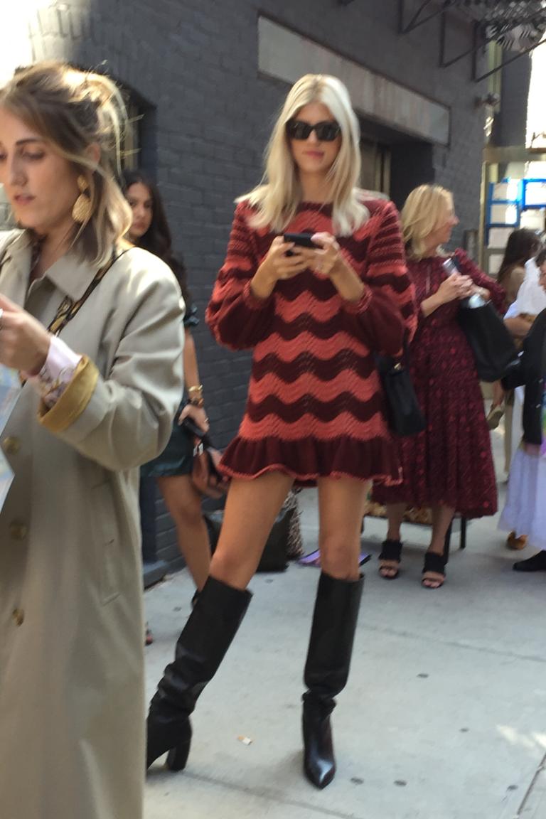 Devon Windsor waiting in line for Ulla’s spring fashion show wearing Ulla’s  hand knit cotton/wool wavy dress made by us for Pre Spring 