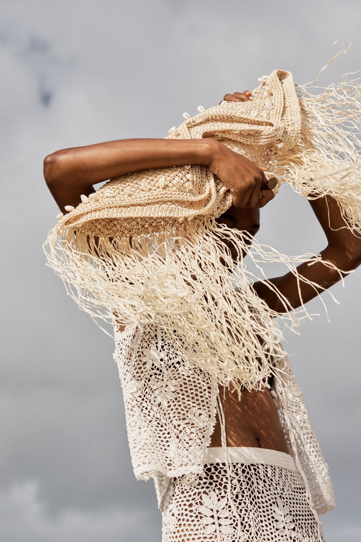 Ilio Nema Resort '26 — white crochet fringe wrap